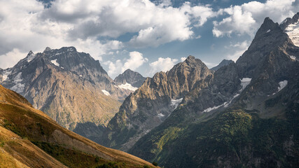 Epic panorama of the autumn Caucasus mountains at sunset. Wallpaper