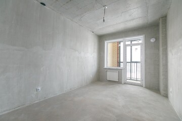 interior of the apartment without decoration in gray colors. rough finish
