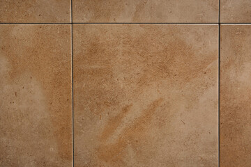 background of square ceramic tiles, with beige marble imitation, top view