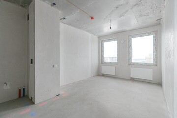 interior of the apartment without decoration in gray colors. rough finish