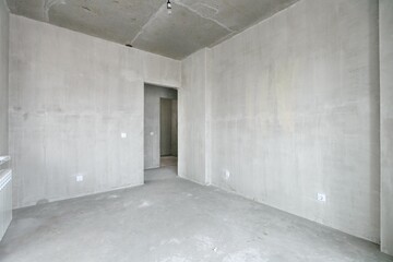 interior of the apartment without decoration in gray colors. rough finish