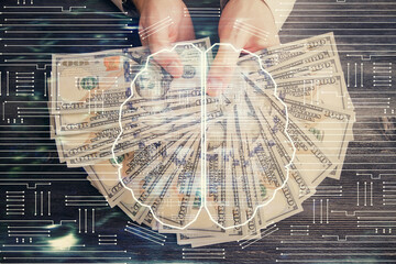 Multi exposure of brain drawing hologram and us dollars bills and man hands. Ai invest concept