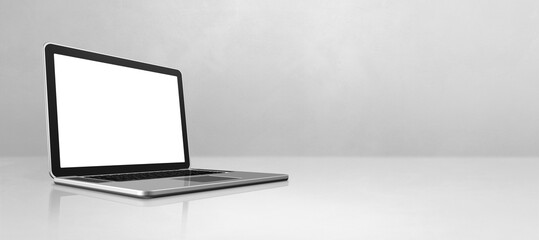 Laptop computer on white concrete office scene background banner