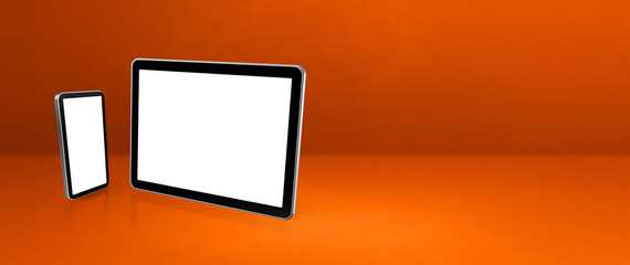 Mobile phone and digital tablet pc on orange office desk. Background banner