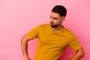 Young mixed race man isolated on pink background