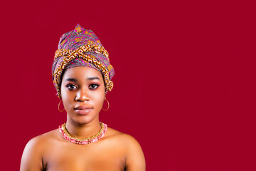 beautiful africa-american woman with turban ower the head in studio