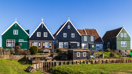Historic Dutch fishing village with colorful wooden houses and church on the former island of...