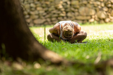 blonde woman practicing yoga in a park, Barueri, São Paulo, Brazil