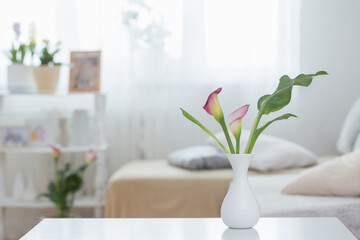 flowers in vase on white table indoor