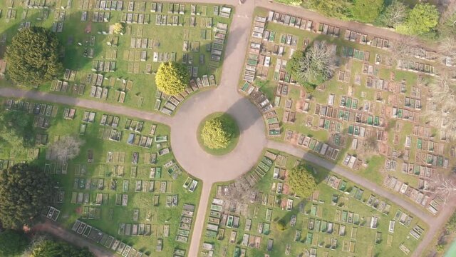 Birds eye view of rows of graves in cemetery graveyard