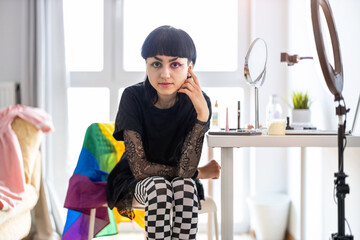 Portrait of a beautiful gender fluid makeup artist
