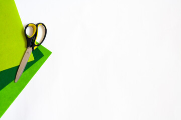 Hobbies and creativity, green felt and scissors, copy space