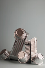 Balance aluminum foil containers for cooking on a light background. Foil environmentally friendly...