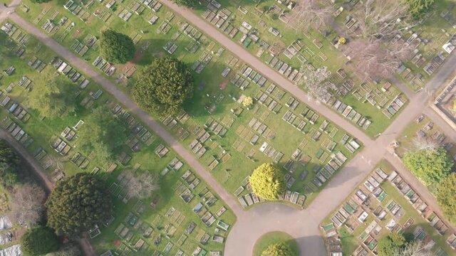 Birds eye view of rows of graves in cemetery graveyard