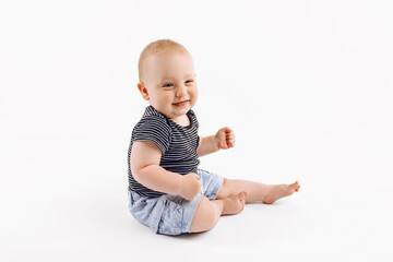 Little happy boy, kid is played on isolated white background