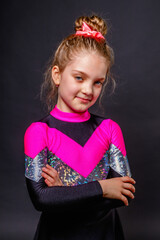 Portrait of a little smiling cheerleader girl