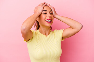 Young caucasian woman isolated on pink background