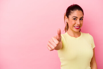 Young caucasian woman isolated on pink background