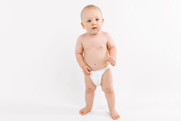 Smiling child standing on white studio background