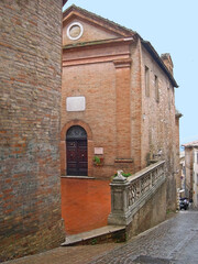 italy, Marche, Urbino, downtown medieval street. 
