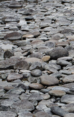 the dried-up bed of a mountain river made of round stones