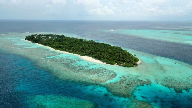 Bird's eye view of tropical islands in the ocean. View of the islands from a drone. Maldives, Thinadhoo (Vaavu Atoll), Dhigurah
