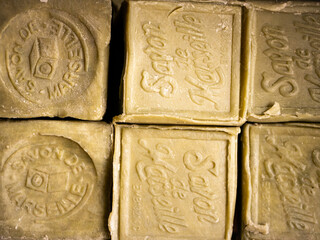 Square bars of organic soap from Provence- typical local market gift for tourists. Close up.