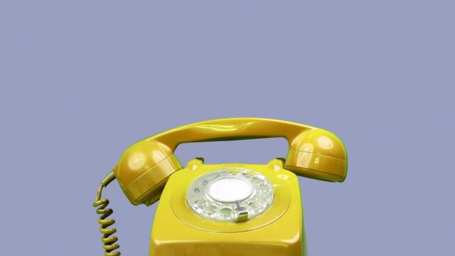 A red classic rotary telephone stop motion
