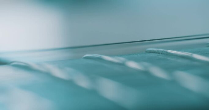 Macro close up of acoustic guitar strings and fret board
