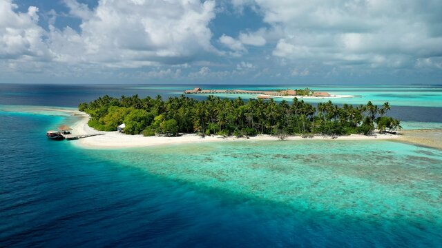 Bird's eye view of tropical islands in the ocean. View of the islands from a drone. Maldives, Thinadhoo (Vaavu Atoll), Dhigurah