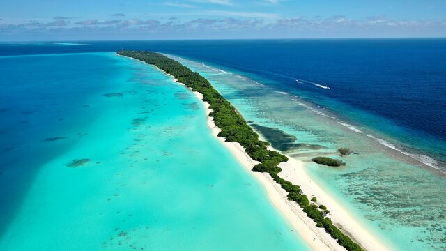 Bird's eye view of tropical islands in the ocean. View of the islands from a drone. Maldives, Thinadhoo (Vaavu Atoll), Dhigurah
