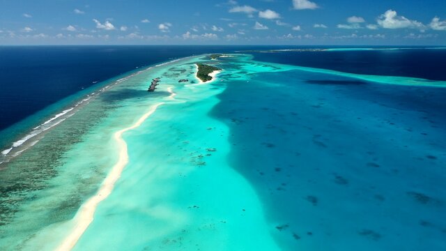 Bird's eye view of tropical islands in the ocean. View of the islands from a drone. Maldives, Thinadhoo (Vaavu Atoll), Dhigurah