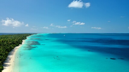 Bird's eye view of tropical islands in the ocean. View of the islands from a drone. Maldives, Thinadhoo (Vaavu Atoll), Dhigurah
