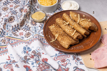 Pancakes on a plate with ham and cheese