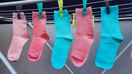 Drying colored socks on the street. High quality photo