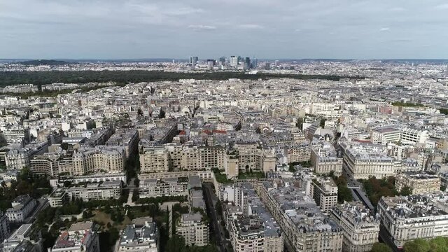 High altitude aerial view of the 16th arrondissement of Paris is one of the 20 arrondissements of the capital city of France showing La Defense neighbourhood in background 4k resolution quality