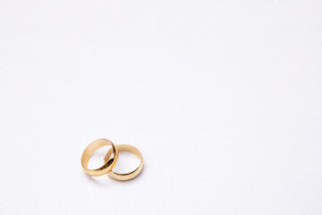 two golden wedding rings isolated on white, wedding rings background concept	