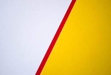 Diagonally divided white and yellow background with red line