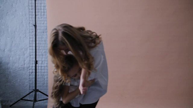 Happy mom and daughter fooling around. Happy Family concept in 4K slow motion