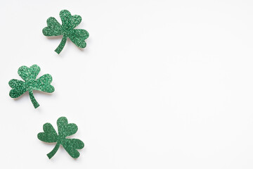 St Patricks Day shamrocks on white background with copy space