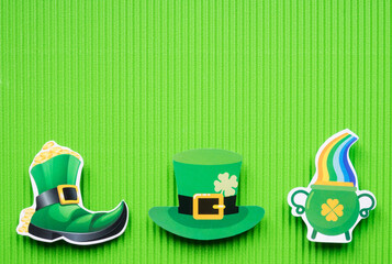 St Patricks Day symbols on green background with copy space