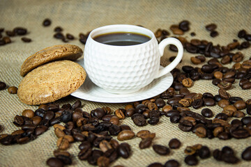 Coffee cup ,coffee beans and cookies.