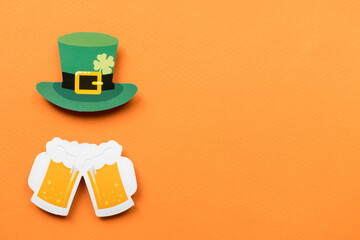 St Patricks Day symbols on orange background with copy space