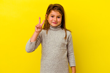 Little caucasian girl isolated on yellow background showing number two with fingers.