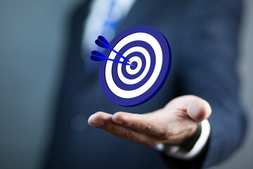 business man holding target icon