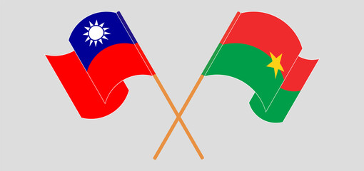 Crossed and waving flags of Taiwan and Burkina Faso