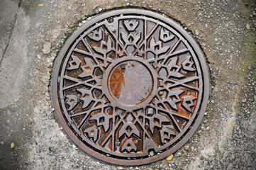 Large steel cover on the road.