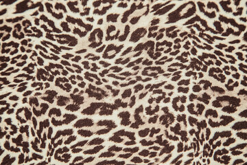 Leopard print pattern fabric texture repeat background effect leopard fabric sample.