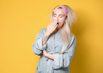 Young woman yawns. Sleepy girl yawning, isolated on white background