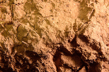 Abstract background of clay wall. Cracked wall. Very rough clay background.